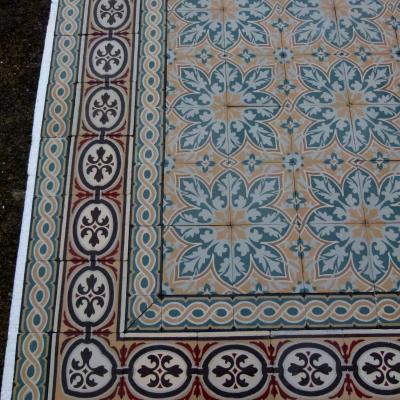 An 11.5m2+ vegetal themed antique French ceramic floor with triple borders