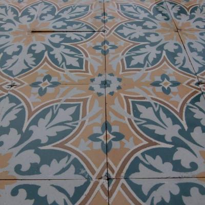 An 11.5m2+ vegetal themed antique French ceramic floor with triple borders