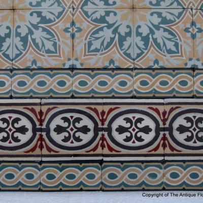 An 11.5m2+ vegetal themed antique French ceramic floor with triple borders