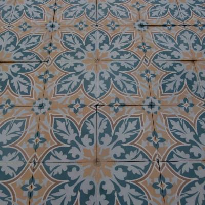 An 11.5m2+ vegetal themed antique French ceramic floor with triple borders