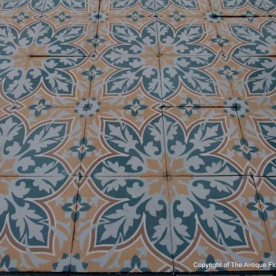 An 11.5m2+ vegetal themed antique French ceramic floor with triple borders