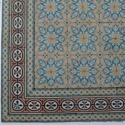 An 11.5m2+ vegetal themed antique French ceramic floor with triple borders