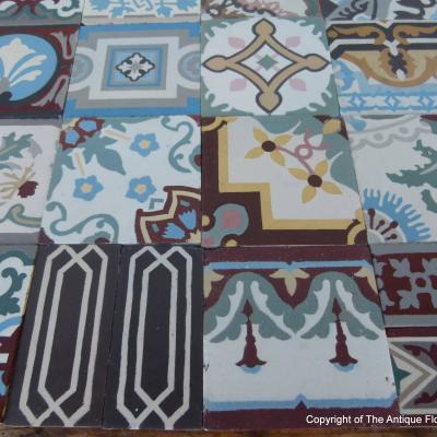 Patchwork of 20 antique French and Belgian ceramic tiles