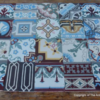 Patchwork of 20 antique French and Belgian ceramic tiles