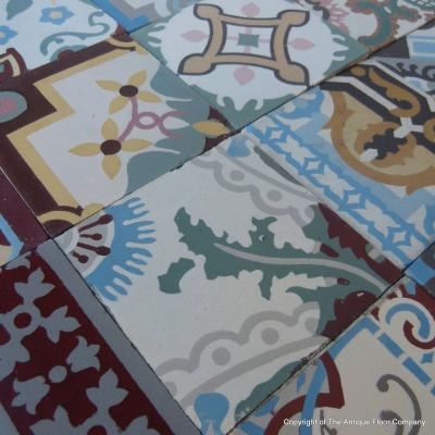 Patchwork of 20 antique French and Belgian ceramic tiles