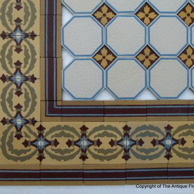 A handmade Boch Freres floor of octagon tiles with cabochons