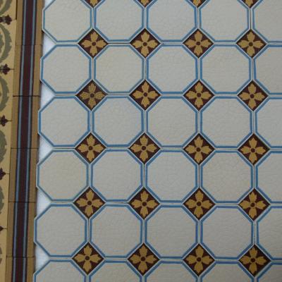 A handmade Boch Freres floor of octagon tiles with cabochons