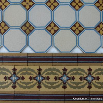 A handmade Boch Freres floor of octagon tiles with cabochons