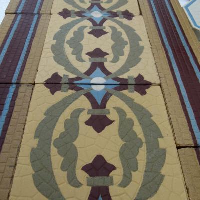 A handmade Boch Freres floor of octagon tiles with cabochons