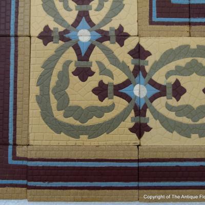 A handmade Boch Freres floor of octagon tiles with cabochons