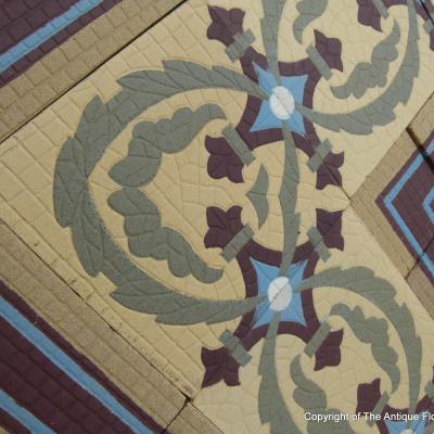 A handmade Boch Freres floor of octagon tiles with cabochons