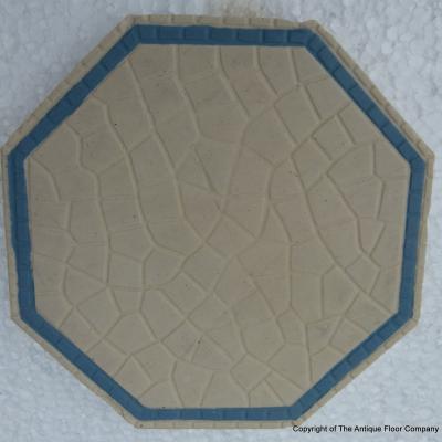 A handmade Boch Freres floor of octagon tiles with cabochons