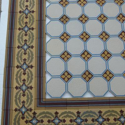 A handmade Boch Freres floor of octagon tiles with cabochons