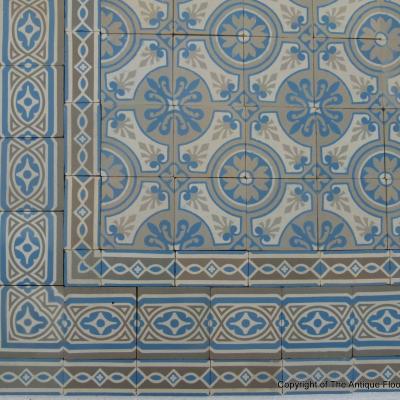 A 7.75m2+ antique ceramic floor in light grey, blue and cream