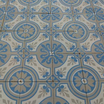 A 7.75m2+ antique ceramic floor in light grey, blue and cream