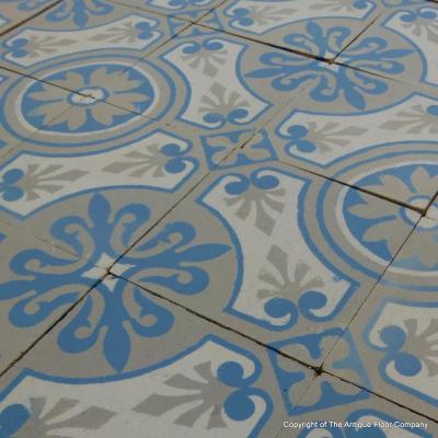 A 7.75m2+ antique ceramic floor in light grey, blue and cream