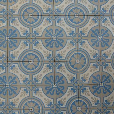 A 7.75m2+ antique ceramic floor in light grey, blue and cream