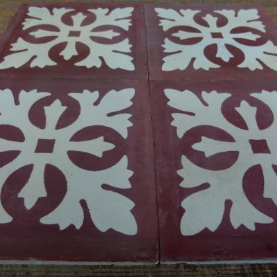 Four antique Carreaux de ciments tiles in bordeaux and white