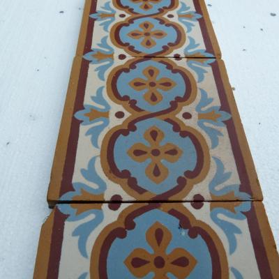 A large run of antique Maubeuge border tiles plus corners