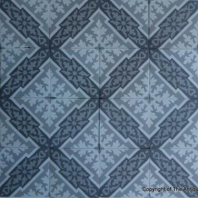 A panel of antique French ceramic encaustic tiles