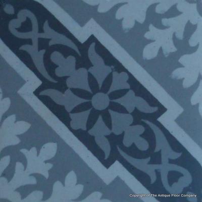 A panel of antique French ceramic encaustic tiles