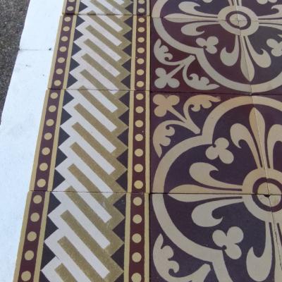 A Sand & Cie heritage ceramic with geometric borders 5.8m2